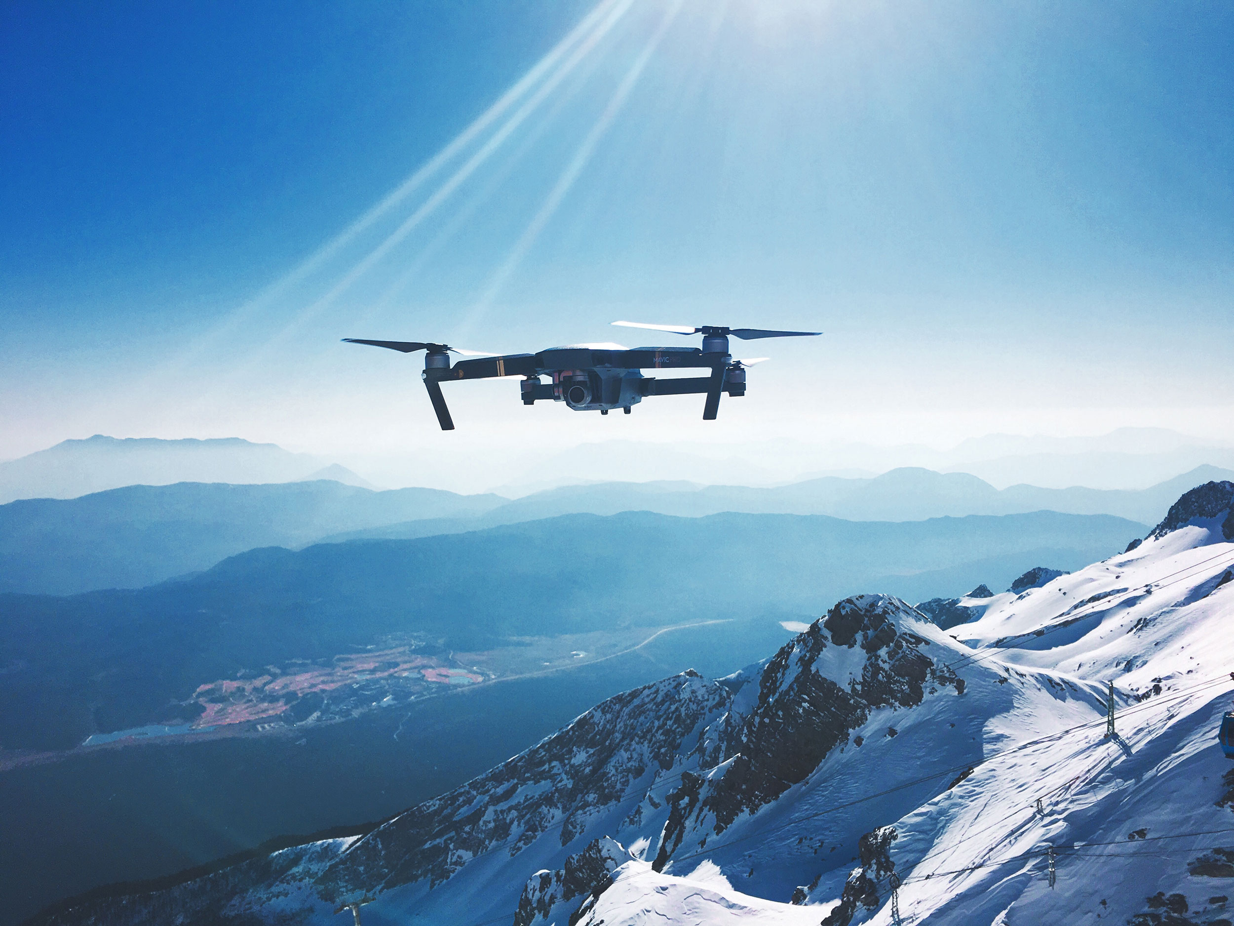 Drone in flight over mountain.