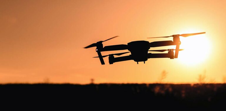 Quadcopter drone at sunset